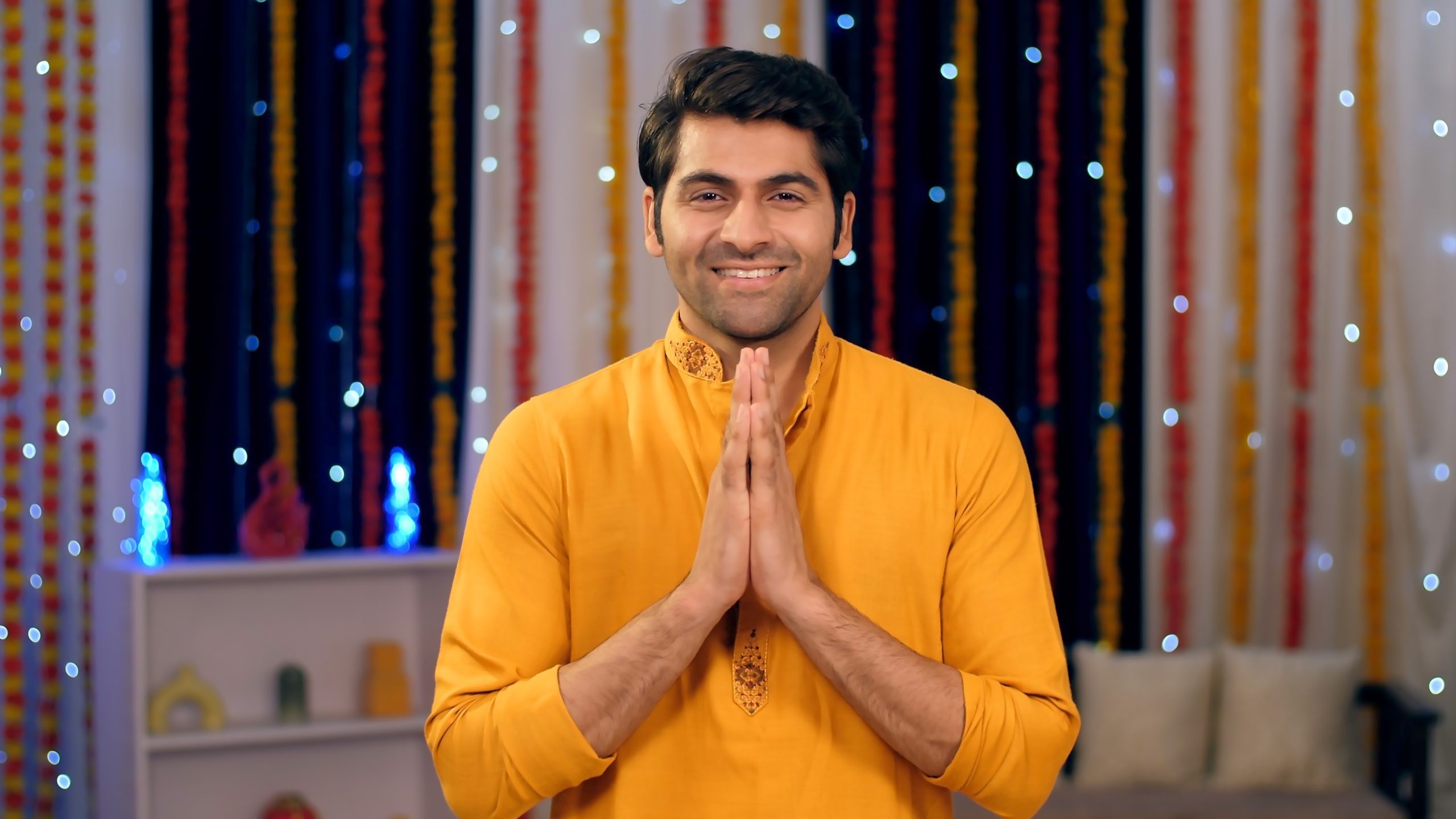 Groom in yellow kurta during traditional Indian Haldi ceremony
