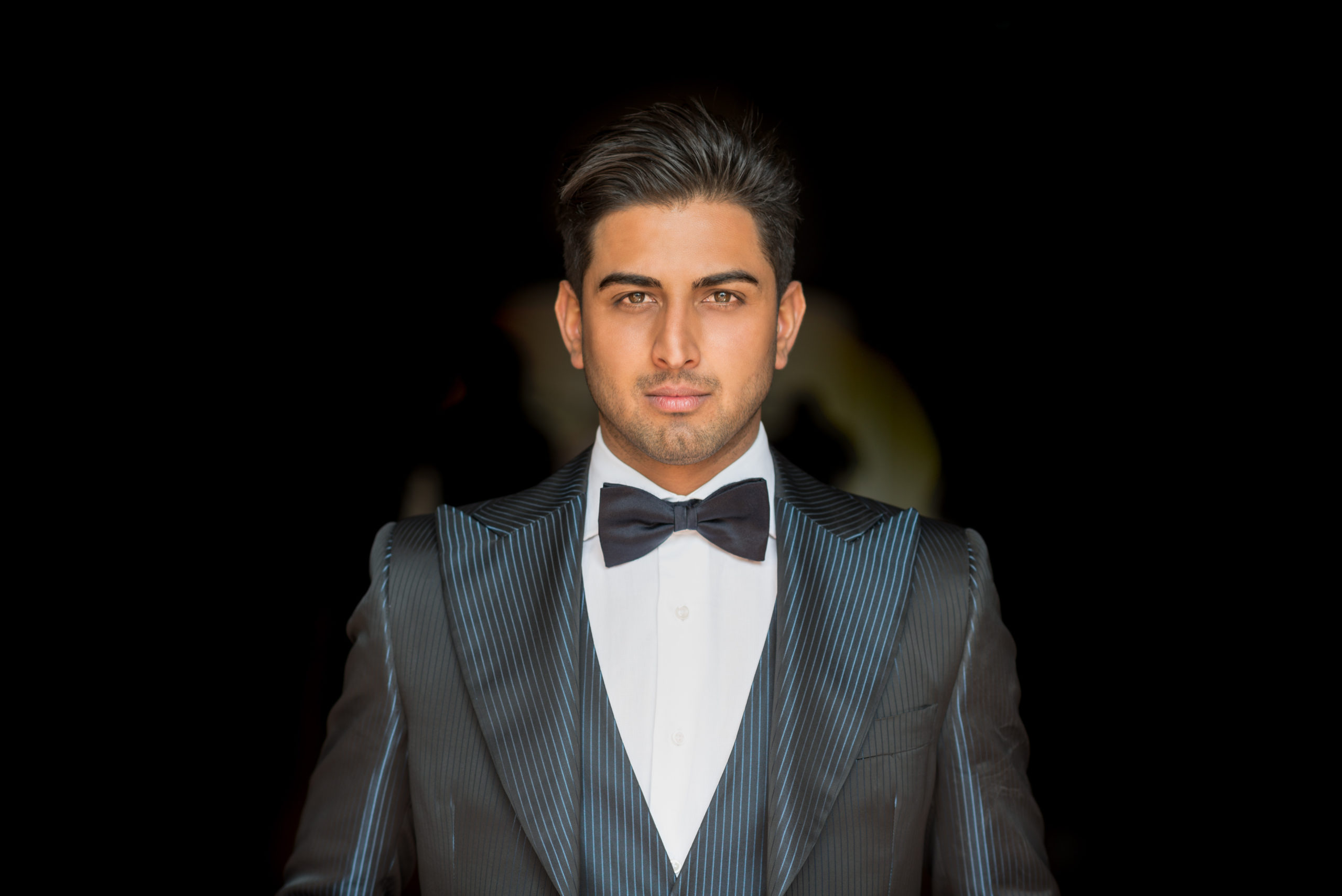 Groom in a tailored black tuxedo